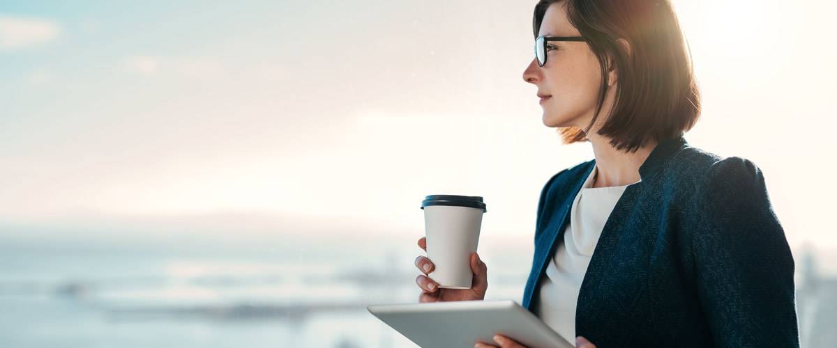 Woman drinking coffee thinking